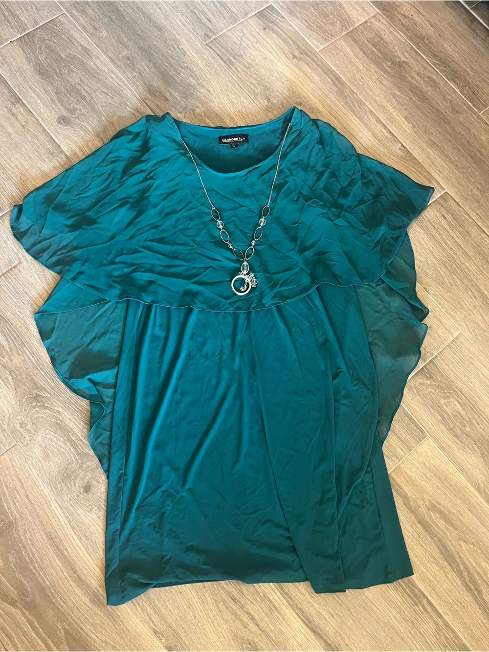 Green cape-style Layered Capelet Blouse with silver tone necklace